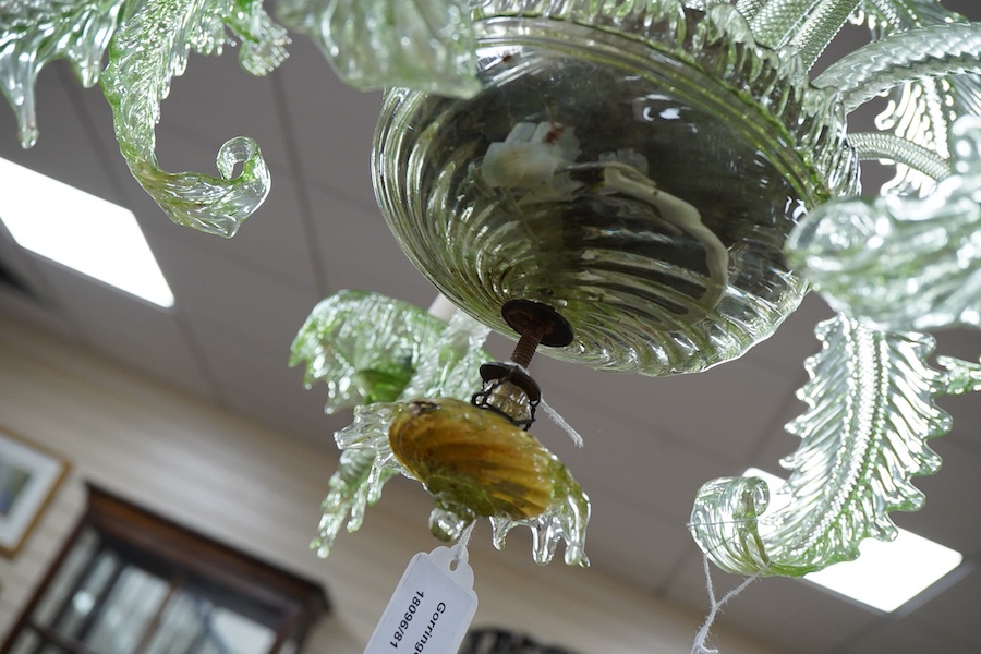 An ornate leaf and floral green glass Murano three branch chandelier, 84cm high.